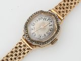 an image of a lady ' s wrist watch with a diamond set bezel