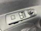a close up of a car ' s door handle and control panel