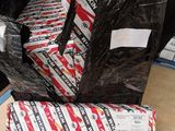 a pile of black plastic bags sitting on top of a table