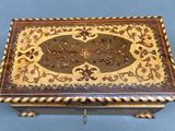 an image of a wooden box with a decorative design on it