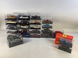 a group of toy cars in a display case on a table