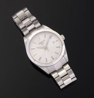 a close up of a wrist watch on a black surface