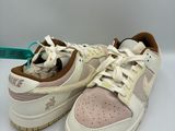white and pink sneakers with stars on them sitting on a white surface