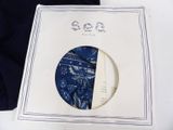 a picture of a blue and white plate with a picture on it