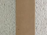 a brown box sitting on a table next to a white wall