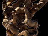 a wooden sculpture of a group of horses on a table