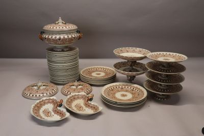 many plates and bowls sitting on a table