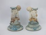 two figurines sitting on top of each other