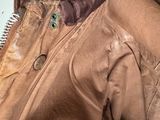 brown leather jacket with zippers and buttons on a white background