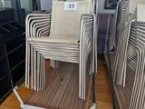 many chairs that are sitting in front of a flat screen tv
