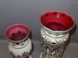 two vases that are sitting on a table