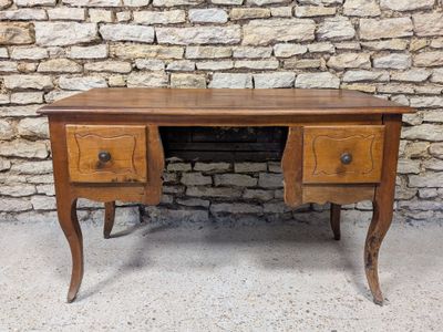 a wooden desk with two drawers and two drawers on top of it