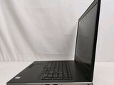 the laptop is sitting on a white surface with a white background
