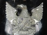 a black helmet with an eagle emblem on it