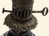 a metal lamp that is sitting on top of a table