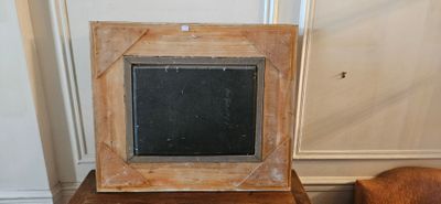 a picture frame sitting on top of a wooden table