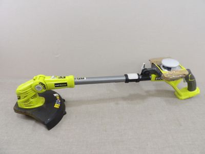 a close up of a corded blower and a blower on a table