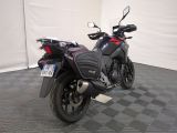 a motorcycle that is parked on the floor in a room
