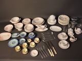 a table with a lot of plates and silverware on it