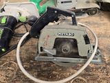 a circular saw sitting on a table next to other circular saws