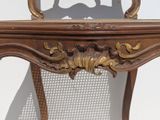 a wooden table with a mirror on top of it