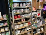 many shelves with various items on them in a store