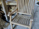 a wooden chair that is sitting in a room