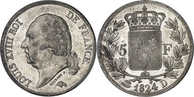 a silver coin with a crown on top of it