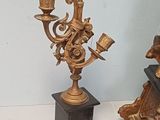 two candles that are sitting on top of a table