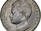a silver coin with a portrait of a man on it