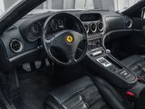 the interior of a car with black leather seats and a steering wheel