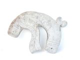 a white horse head sculpture on a white surface