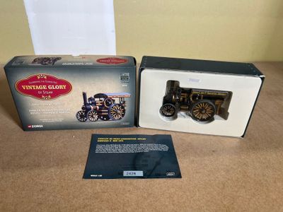 an old fashioned model of a steam engine in a box