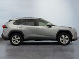 the toyota rav is parked in a room with a white wall
