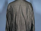 the back of a black leather jacket on a mannequin stand