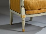 an image of a chair with a yellow upholstered cushion and wooden legs