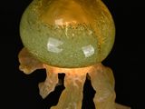 a jelly shaped candle that is lit up in the dark