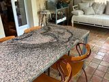 a table with chairs and a couch in the room