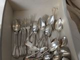 a box of silverware sitting on a table