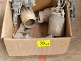a cardboard box with two spray guns in it on the floor