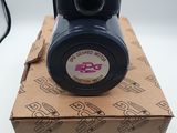 a black camera sitting on top of a cardboard box