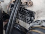 a close up of a motorcycle with a number plate on it