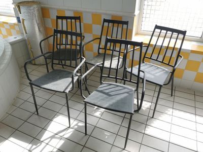 four chairs in a room with yellow and white checkered walls