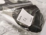a plastic bag with a pair of scissors inside of it