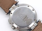 a close up of a watch on a white surface
