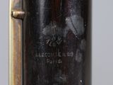 an image of a close up of a metal object with writing on it