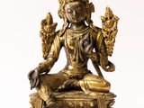an image of a statue of a woman sitting on top of a table