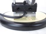 a close up of a metal device on a table