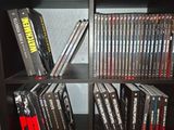 a book shelf with a bunch of dvds on it
