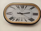 a clock with roman numerals on the face of it